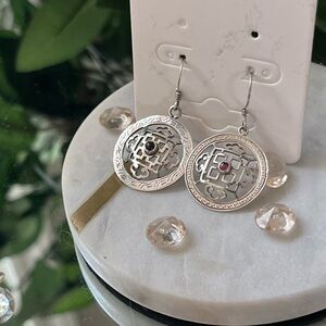 Elegant Sterling Silver Dangle Earrings with Intricate Design and Center Stone